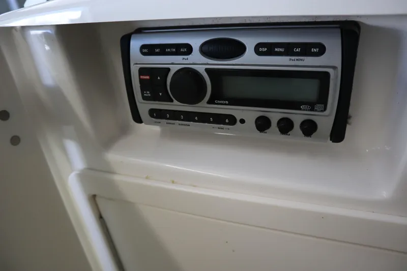 Slide: The Image of 2009 Chaparral Sunesta 244 boat stereo system with control panel and display. - 13