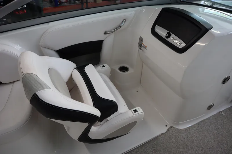 Slide: The Image of 2009 Chaparral Sunesta 244 boat interior with white and black seating. - 20
