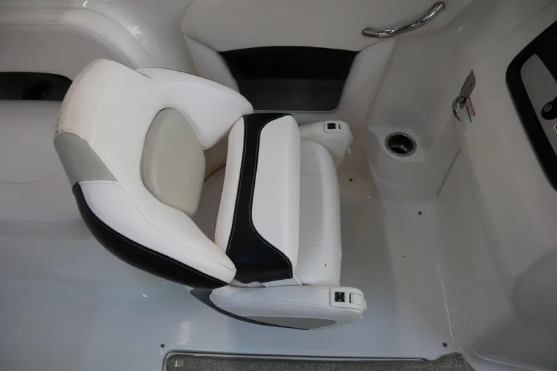 Slide: The Image of 2009 Chaparral Sunesta 244 boat interior with white and black seating. - 22