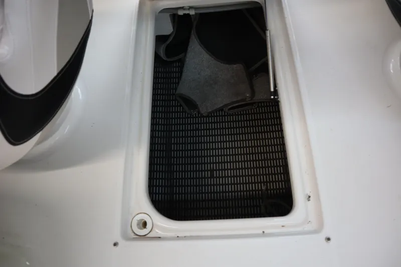 Slide: The Image of Storage compartment on a 2009 Chaparral Sunesta 244 boat. - 24
