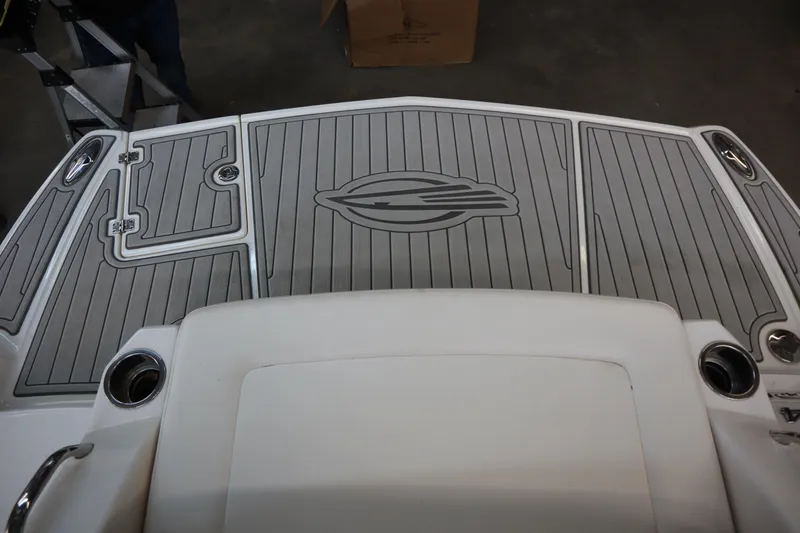 Slide: The Image of 2009 Chaparral Sunesta 244 boat deck with logo and cup holders. - 29