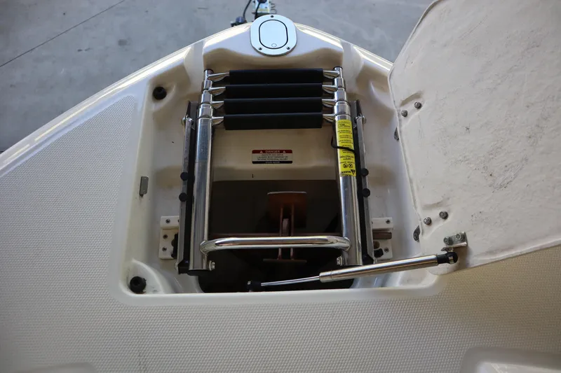 Slide: The Image of Bow storage compartment of 2009 Chaparral Sunesta 244 with ladder and hydraulic support. - 5