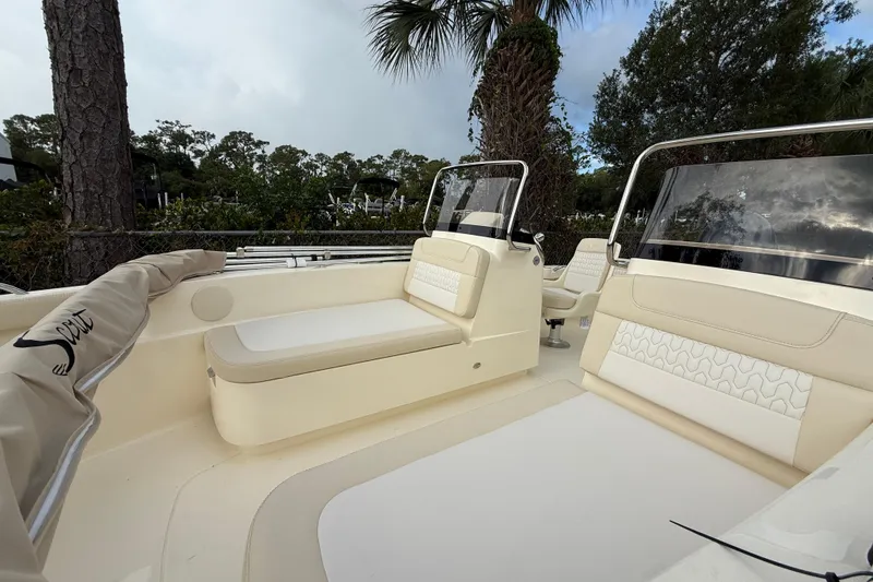 Slide: The Image of 2026 Scout 188 Sport Dorado boat interior with beige seating and sleek design. - 10