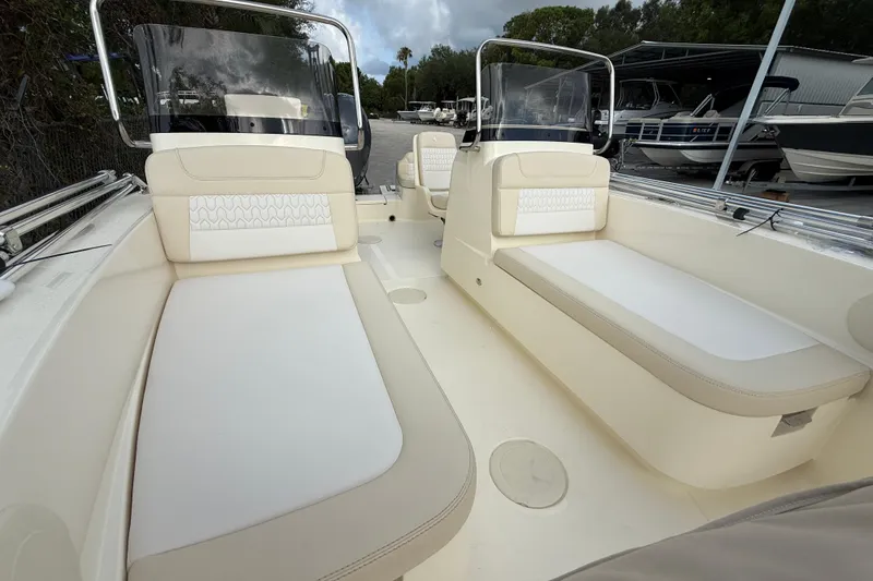 Slide: The Image of 2026 Scout 188 Sport Dorado boat interior with beige seating and sleek design. - 8