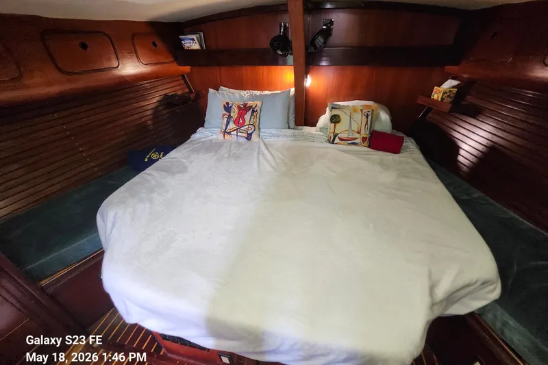 Slide: The Image of Cozy cabin interior of 1986 Beneteau Idylle 15.50 sailboat with comfortable bedding. - 17