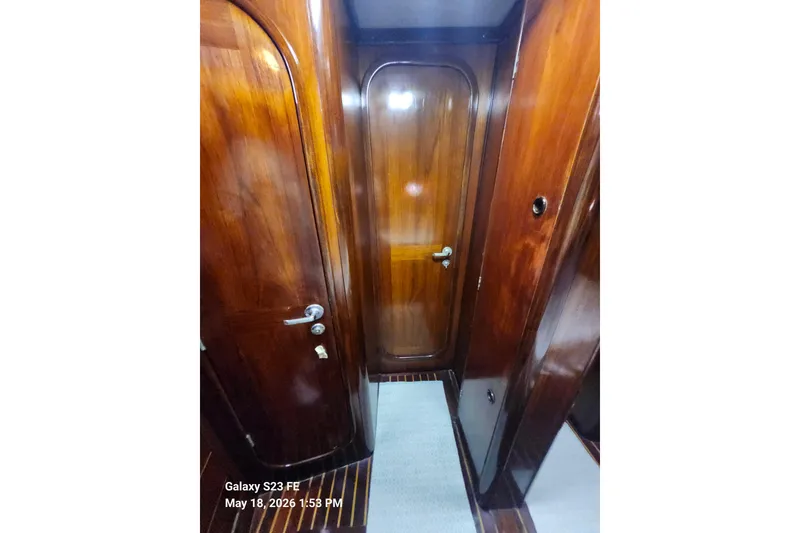 Slide: The Image of Interior of 1986 Beneteau Idylle 15.50 yacht with polished wooden doors. - 20