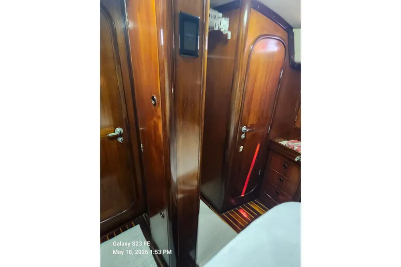 Slide: The Image of Interior of 1986 Beneteau Idylle 15.50 yacht with wooden cabinetry and doors. - 24