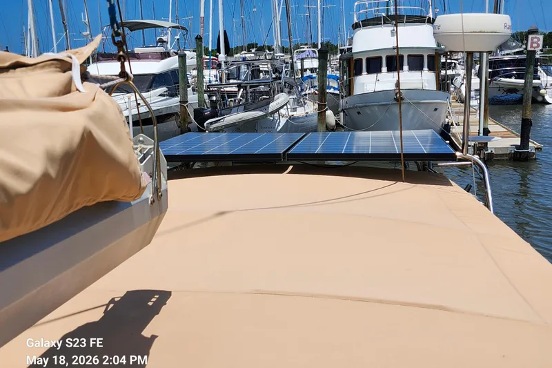Slide: The Image of Beneteau Idylle 15.50 sailboat with solar panels docked at marina, 1986 model. - 29