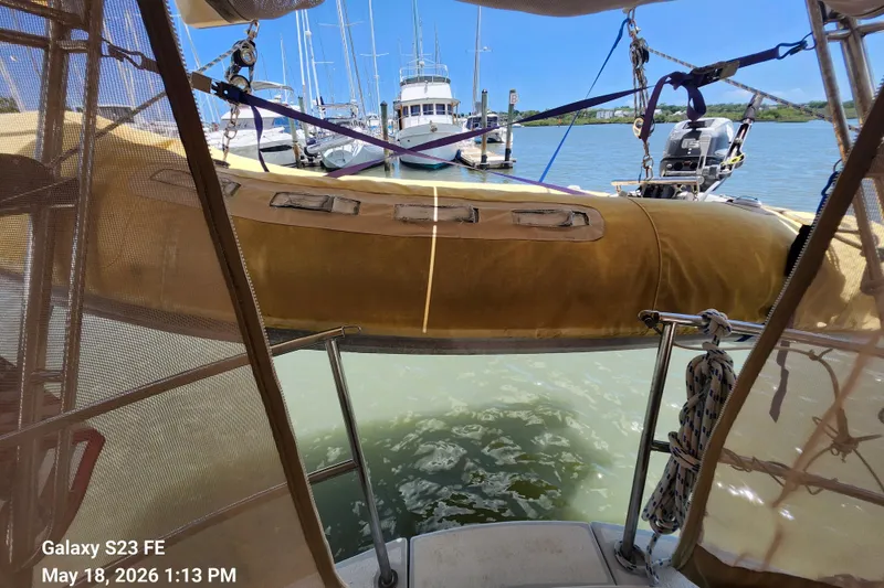 Slide: The Image of Beneteau Idylle 15.50 sailboat with dinghy, docked at marina, sunny day, 1986 model. - 37