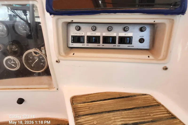 Slide: The Image of Control panel on a 1986 Beneteau Idylle 15.50 sailboat with switches and gauges. - 40