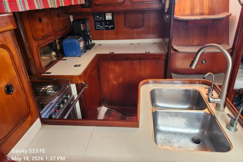 Slide: The Image of Interior of 1986 Beneteau Idylle 15.50 yacht kitchen with sink and stove. - 48