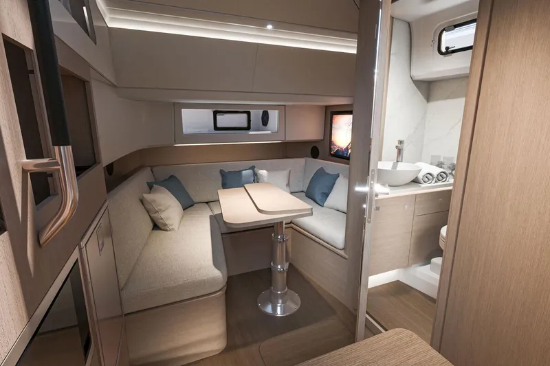Slide: The Image of Luxurious interior of 2026 Beneteau Grand Turismo 35 yacht with modern seating and elegant decor. - 11
