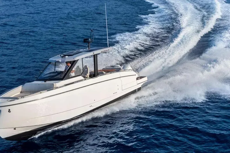 Slide: The Image of 2026 Beneteau Gran Turismo 35 yacht cruising swiftly on open blue waters. - 2