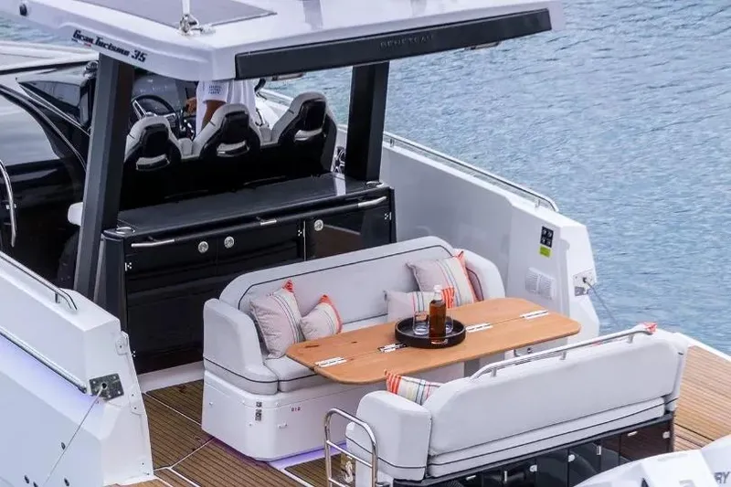 Slide: The Image of 2026 Beneteau Gran Turismo 35 yacht with elegant seating and dining area on deck. - 9