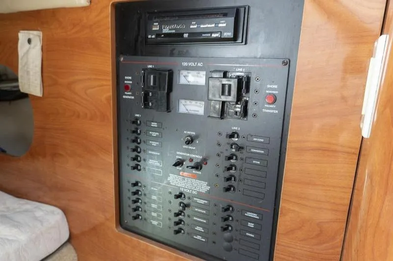 Slide: The Image of Electrical control panel inside a 2005 Larson Cabrio 290 boat cabin. - 19