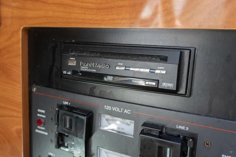 Slide: The Image of Control panel with Planet Audio DVD player on 2005 Larson Cabrio 290 boat. - 20