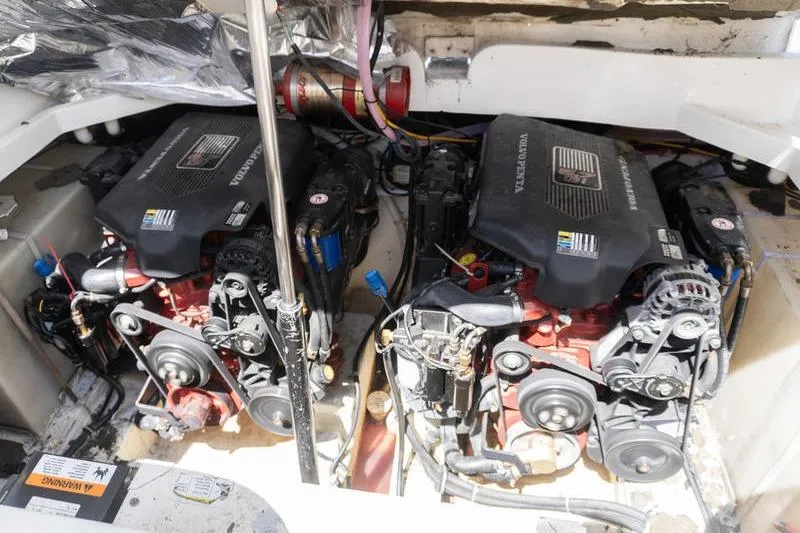 Slide: The Image of Twin Volvo Penta engines in a 2005 Larson Cabrio 290 boat engine compartment. - 23