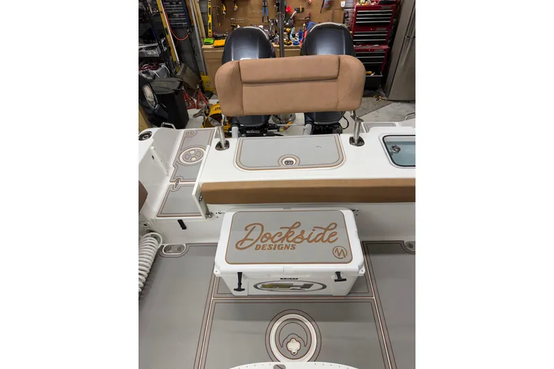 Slide: The Image of 2019 Sea Hunt Gamefish 25 interior with Dockside Designs cooler and seating. - 28