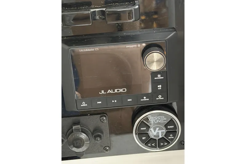 Slide: The Image of Control panel of a 2019 Sea Hunt Gamefish 25 featuring JL Audio MediaMaster 105. - 29