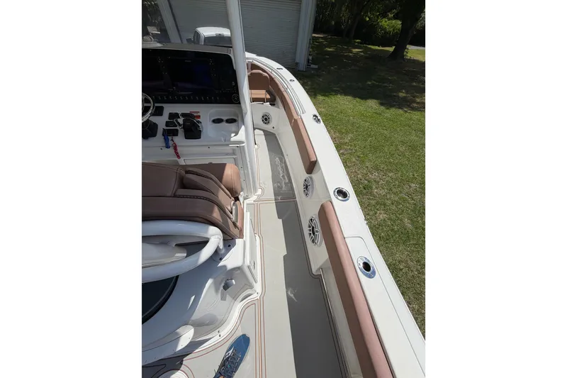 Slide: The Image of 2019 Sea Hunt Gamefish 25 boat interior with seating and control panel. - 32