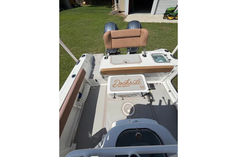 Slide: The Image of 2019 Sea Hunt Gamefish 25 boat interior with seating and storage compartments. - 34