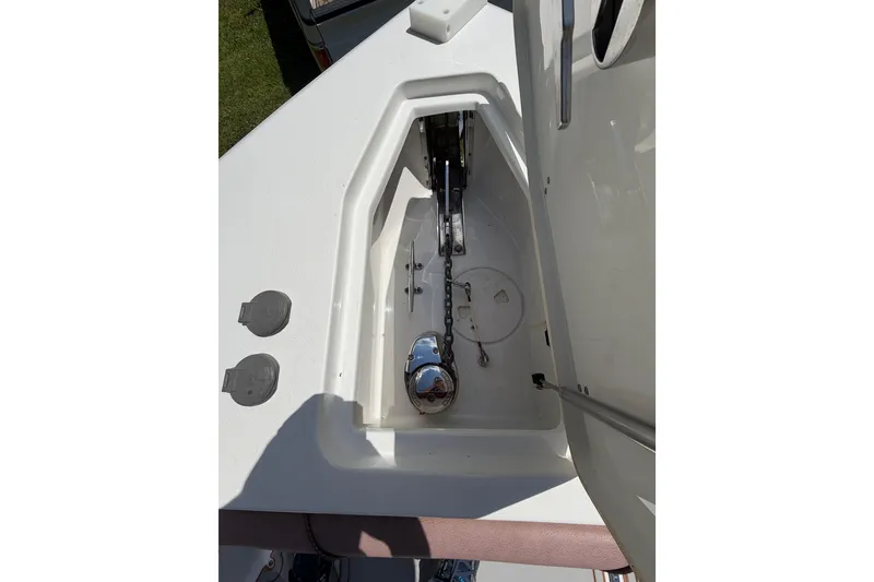 Slide: The Image of 2019 Sea Hunt Gamefish 25 anchor compartment with chain and winch. - 36