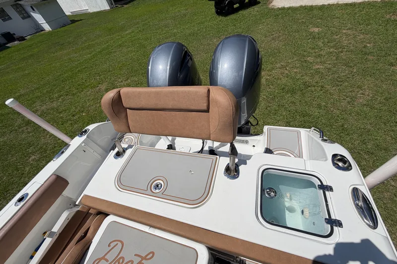 Slide: The Image of 2019 Sea Hunt Gamefish 25 boat with dual engines and cushioned seating. - 37