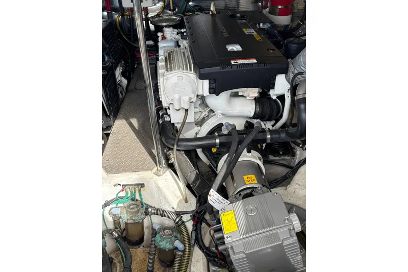 Slide: The Image of Engine compartment of a 2015 Regal 42 Sport Coupe boat, showcasing mechanical components. - 33