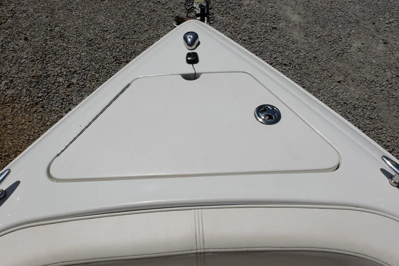 Slide: The Image of Bow of a 2004 Cobalt 200 boat with white deck and chrome fittings. - 13