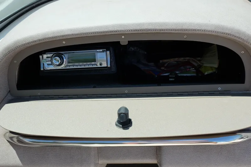 Slide: The Image of Dashboard of a 2004 Cobalt 200 boat featuring a stereo system. - 19