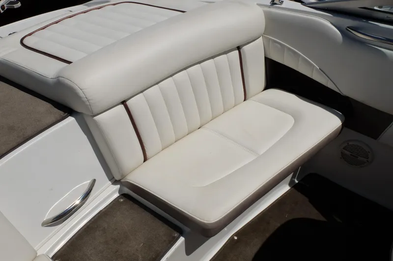Slide: The Image of White leather seating in a 2004 Cobalt 200 boat interior. - 25