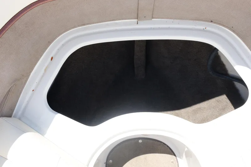 Slide: The Image of Open storage compartment in a 2004 Cobalt 200 boat interior. - 9