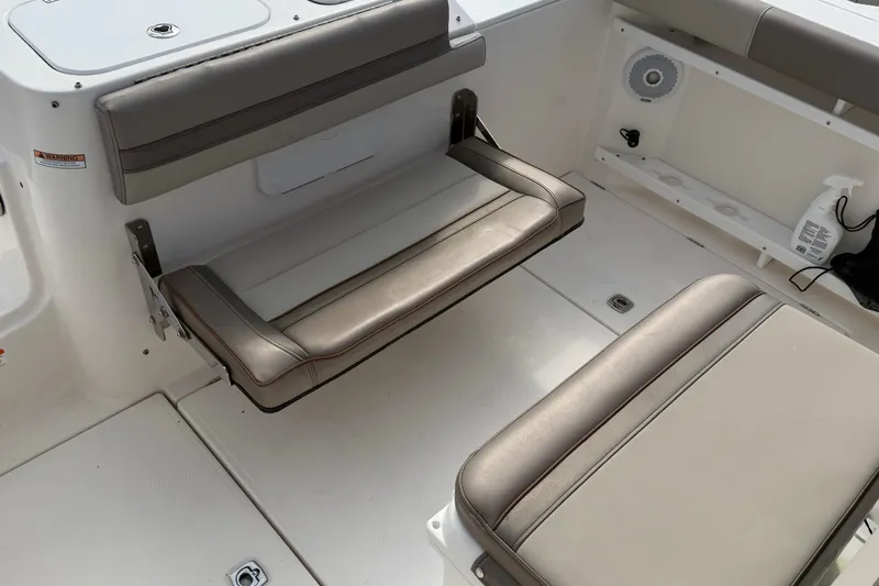 Slide: The Image of Interior of 2020 Solara S-250 CW boat with cushioned seating and storage. - 10