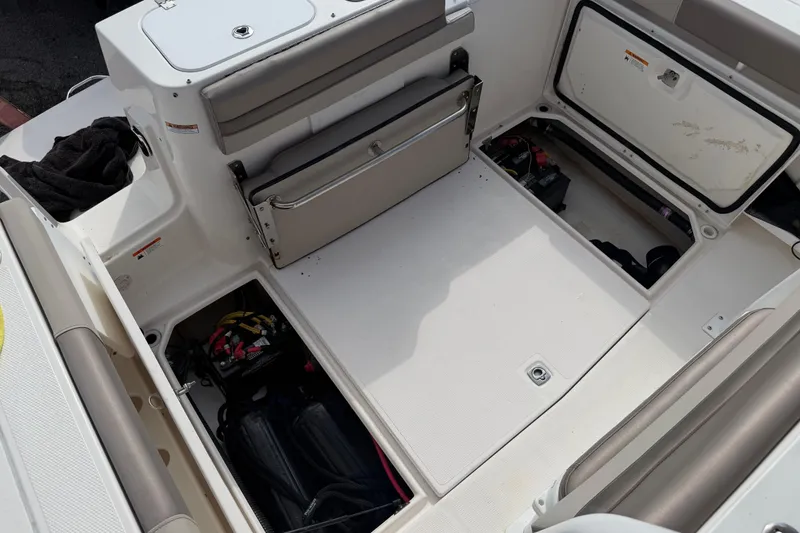 Slide: The Image of Interior view of a 2020 Solara S-250 CW boat with open storage compartments. - 11