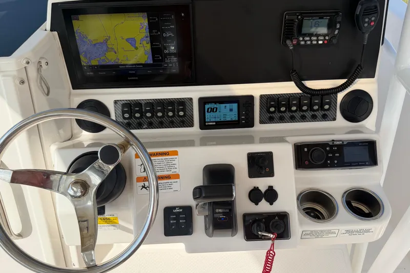 Slide: The Image of 2020 Solara S-250 CW boat dashboard with navigation and control systems. - 14