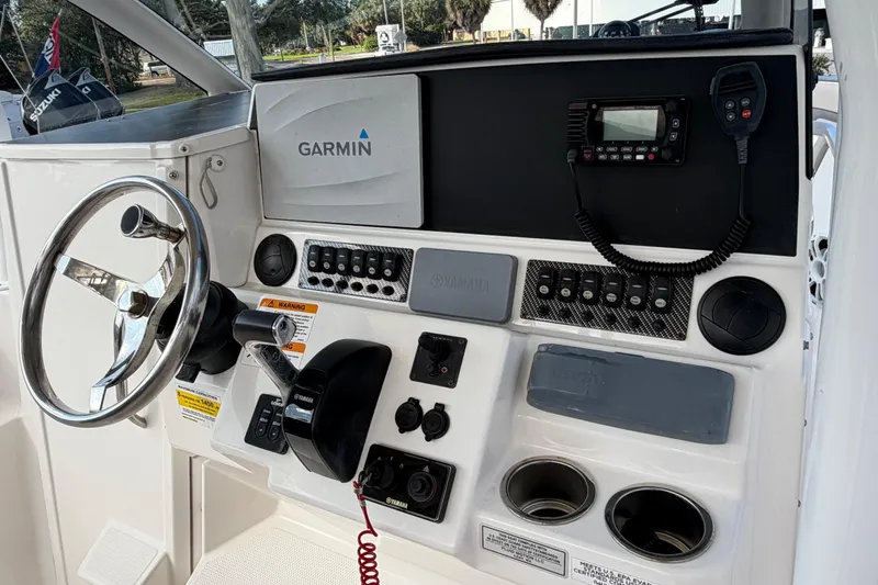 Slide: The Image of 2020 Solara S-250 CW boat dashboard with Garmin navigation and Yamaha controls. - 15