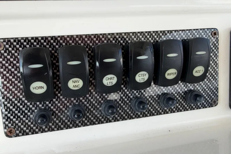 Slide: The Image of Control panel of 2020 Solara S-250 CW boat with labeled switches. - 17