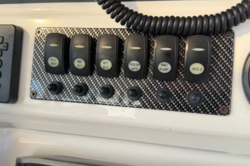 Slide: The Image of Control panel with switches for blower, bilge, water, and accessories on a 2020 Solara S-250 CW. - 18