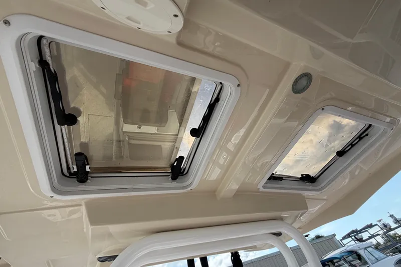 Slide: The Image of 2020 Solara S-250 CW boat interior roof with dual hatches and sleek design. - 19