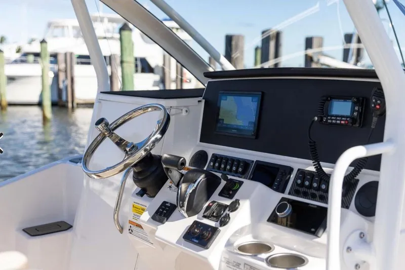 Slide: The Image of Helm of 2020 Solara S-250 CW boat with navigation equipment and steering wheel. - 2