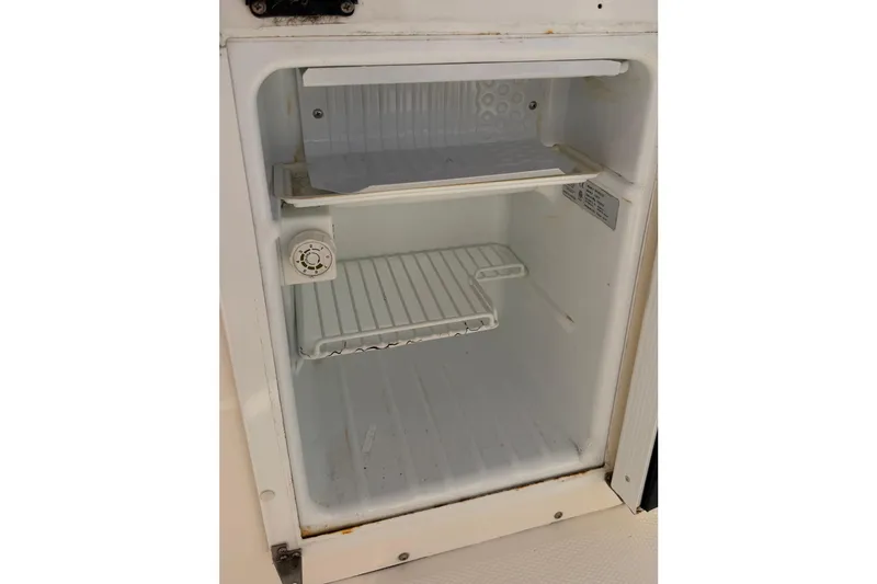 Slide: The Image of Open white refrigerator interior, Solara S-250 CW, 2020 model, with adjustable shelves. - 23