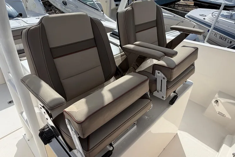Slide: The Image of 2020 Solara S-250 CW boat seats with adjustable armrests and cushioned design. - 24