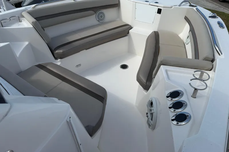 Slide: The Image of 2020 Solara S-250 CW boat interior with cushioned seating and cup holders. - 29