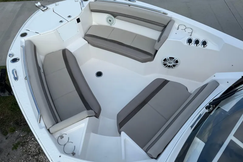 Slide: The Image of Spacious seating area on 2020 Solara S-250 CW boat, featuring comfortable cushions and cup holders. - 30