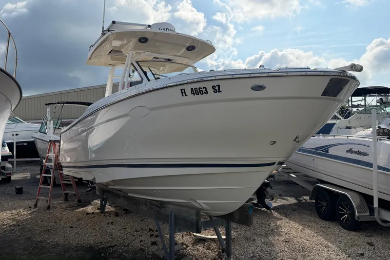 Slide: The Image of 2020 Solara S-250 CW boat on dry dock under cloudy sky. - 5