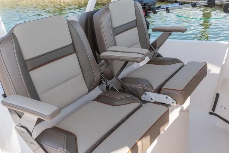 Slide: The Image of Luxury seating on 2020 Solara S-250 CW boat, featuring plush, adjustable armrests. - 6