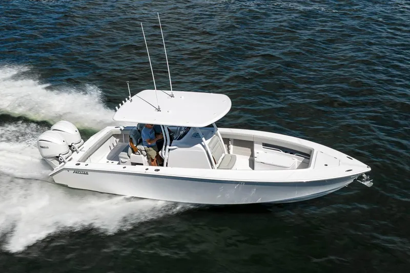 Slide: The Image of Manufacturer Provided Image: 2026 Jupiter 30 boat cruising on water with twin Yamaha engines. - 1
