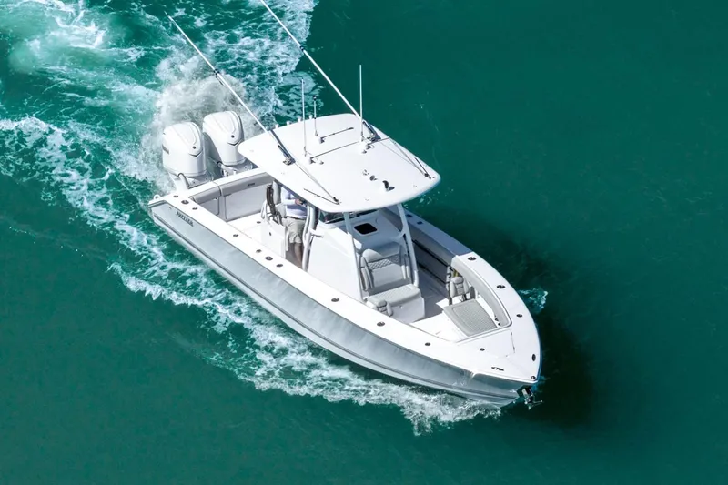 Slide: The Image of Manufacturer Provided Image: Aerial view of 2026 Jupiter 30 boat cruising on turquoise water. - 2