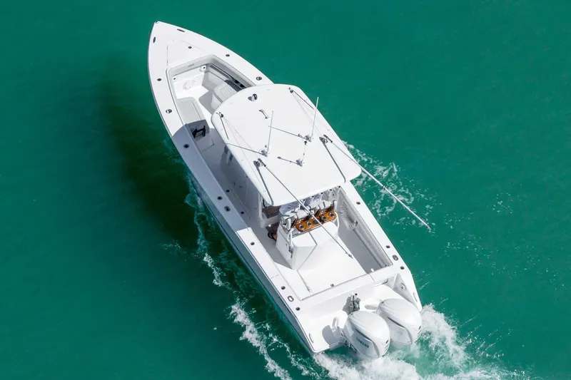 Slide: The Image of Manufacturer Provided Image: 2026 Jupiter 30 boat cruising on turquoise water, aerial view. - 3