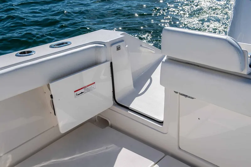 Slide: The Image of Manufacturer Provided Image: Interior view of 2026 Jupiter 30 boat with open hatch and ocean backdrop. - 7